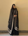 Complete outfit view featuring black floral kurta, embroidered dupatta, and micro cotton palazzo.