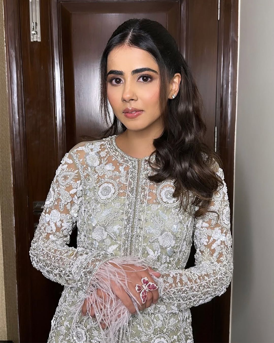  Front view of Western embroidered top with sequin palazzo and stylish koti.

