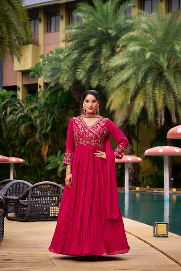 "Elegant Pink Anarkali Gown With Golden Flowy Design For Festive Or Wedding Occasions"