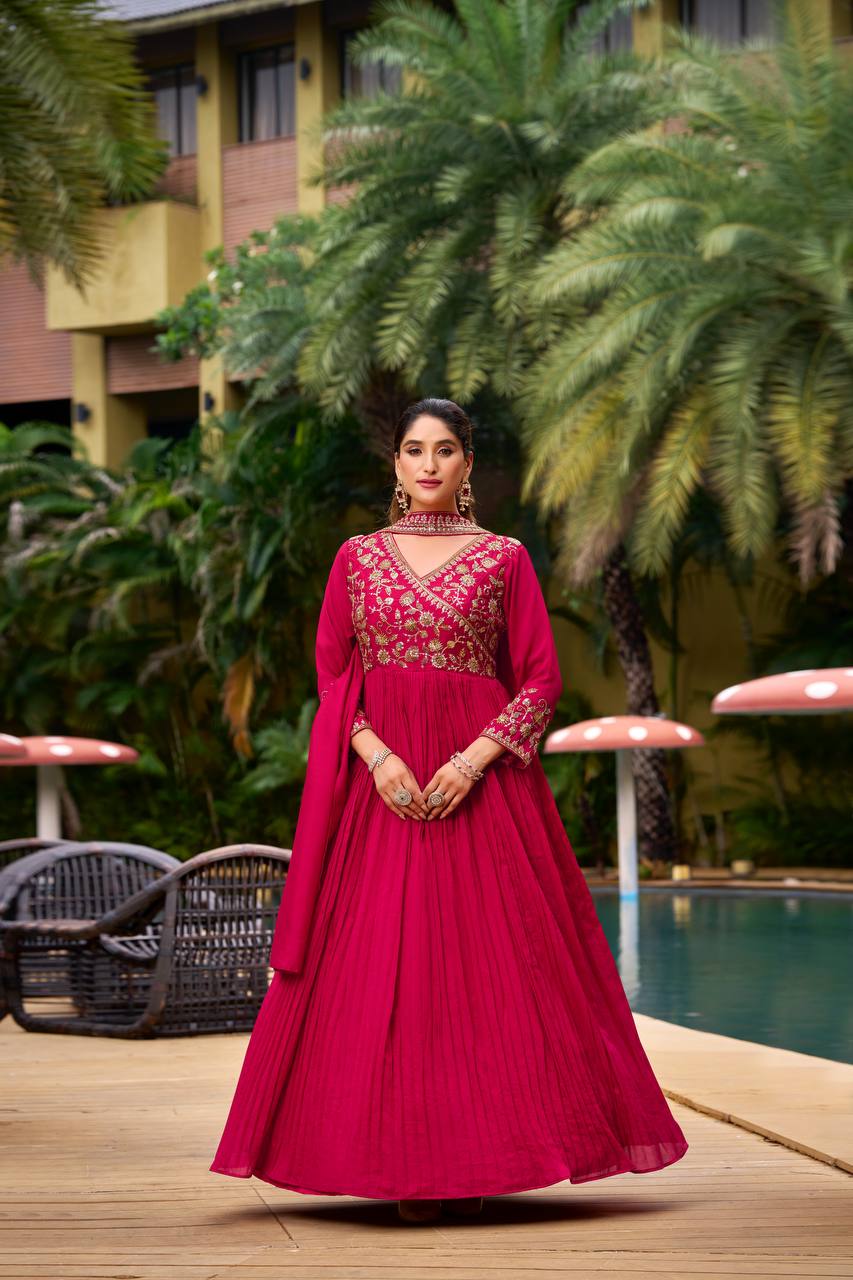 "Elegant Pink Anarkali Gown With Golden Flowy Design For Festive Or Wedding Occasions"